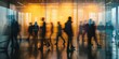 © Iryna - Blurred motion of people walking in a busy office corridor, illustrating modern business.