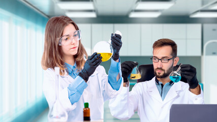 Poster - two doctors with test tubes. teamwork of medical staff. scientists work in laboratory. man and woman