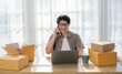 Startup small business entrepreneur SME, asian senior man receive order on phone. Portrait young Asian small business owner home office, online sell marketing delivery, SME e-commerce telemarketing