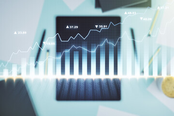 Poster - Abstract creative financial graph and modern digital tablet on desktop on background, top view, financial and trading concept. Multiexposure