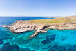 Beautiful beach and water bay in the greek spectacular coast of Peloponnese. Turquoise blue transparent water, unique rocky cliffs, Greece summer top travel destination. Aerial view.