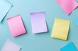 A variety of colorful post-it notes on a blue background.