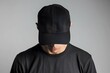 © Lusi_mila - Man wearing blank black baseball cap, mockup