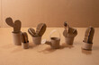 set of paper cut out on cardboard, cute cactus craft and watering can made by kids,