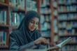 © darshika - Arabic woman taking notes preparing exam and learning lessons from a book at library.