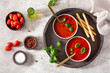 tomato and bell pepper vegetarian soup on green background