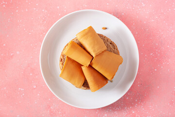 Sticker - fresh bun with Norwegian brunost traditional brown cheese