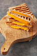 grilled cheese sandwich on wooden board