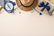 A creative Father's Day arrangement featuring a Happy Father's Day label, straw hat, glasses, wrapped gifts, and hand tools on a plain beige background