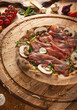 Savory pizza topped with prosciutto