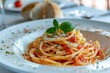 Al dente pasta pomodoro with basil, a staple food on the table
