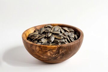 Wall Mural - Photographed wooden bowl with sunflower seeds on white background