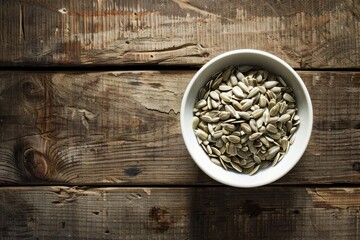 Wall Mural - Sunflower seeds in bowl on table