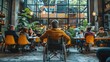 © thekob5123 - The disabled person in a wheelchair engage with their computer. working with team in office.