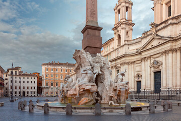 Wall Mural - The famous fountains with tritons in Piazza Navona in Rome at dawn.