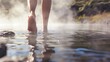 Solo traveler at a geothermal pool, close-up on feet stepping into steamy water, volcanic landscape