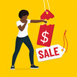 Woman tearing a price tag, sale and discounts concept