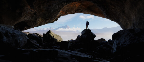 Wall Mural - adult adventurous man standing in a cave. 3d rendering mountain adventure artwork.