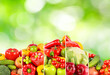 Collage fruits and vegetables separated vertical lines on green blurred background.