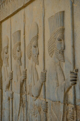 Wall Mural - Reliefs at the ruins of Persepolis near the city of Shiraz in Fars province, Iran.