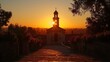 Golden Sunset Behind a Silhouette of a Church Bell Tower and Cross Amidst Blossoming Flowers