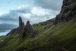 Dark moody scottish landscape with old man of storr on a rainy day. copy space travel banner