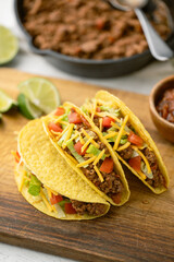 Wall Mural - yellow hard shell tacos  on cutting board