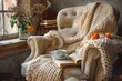 © Ева Поликарпова - Comfortable chair with cozy blanket and a warm cup of coffee. Perfect for home decor or relaxation concepts