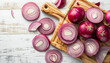 © Nate - Board with slices of fresh red onion on white wooden background