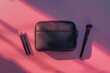 Stylish black cosmetic bag with a pair of makeup brushes neatly arranged on a solid background under soft lighting