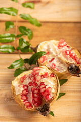 Wall Mural - Pomegranate, a beautiful pomegranate on rustic wood, selective focus.