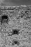 Fototapeta  - Fragment of a stone defensive wall of a medieval castle in Olsztyn