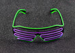 glowing neon glasses isolated on black background
