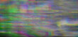 Background texture of retro CCTV or VHS video with multicolored noise.