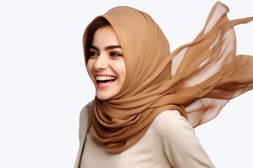 Wall Mural - Portrait of beautiful caucasian happy smiling woman wearing pastel hijab over white png background. Waving head scarf, femininity, concept of goods for muslim islamic women. Copy space for design.