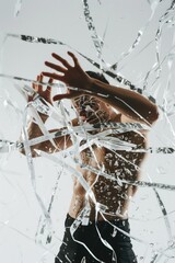 Aufkleber - A man standing in front of a broken glass window, suitable for crime scene or vandalism concept