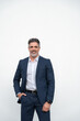 © Stock 4 You - Smiling senior business leader man standing proudly, looking at camera on isolated white background. Confident portrait 40s mature successful businessman freelance entrepreneur in suit, vertical.