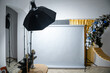 Empty Photo studio with softboxes on tripods and a photo backdrop