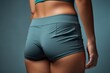 © Balaraw - Fit woman's midsection in workout clothes