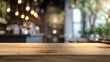 Wooden table with blurred coffee shop or restaurant background