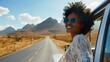 © FANI ICONS - Woman on the road from car window, enjoying desert view and traveling in summer vacation and explore the freedom of nature in the sun