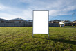Blank white mockup background texture of a real estate board on a vacant lot of land.  Real estate advertisement for future homes property, sign in a neighbourhood with many new developed houses.