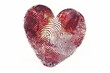 Heart silhouette made from a fingerprint pattern texture, ruby color palette, white background