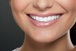 © Balaraw - Closeup of a smiling woman's face with perfect teeth