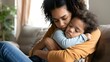 © PSCL RDL - Young mom embracing and calming her child while he in bad mood or upset feelings