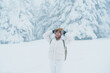 Woman tourist sightseeing Snow monster in Winter day at Mount Zao, Yamagata prefecture, Japan. Happy Traveler walking on powder snow covered in frosty weather. Travel, Adventure and Vacation