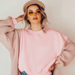 © Alena - Young woman in pink sweatshirt mockup. White female model in casual blank long sleeve shirt, front view design template. Women apparel, clothing, outfit mock up