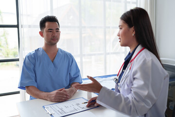 Wall Mural - The doctor is examining the patients according to the checklist, annual visits to the doctor for physical examination. And follow the symptom check after taking medicine, health examination concept