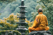 A monk sits on a rock in a forest