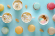 Different types of coffee cup and dessert macarons on blue background. Top view. Flat lay style	
